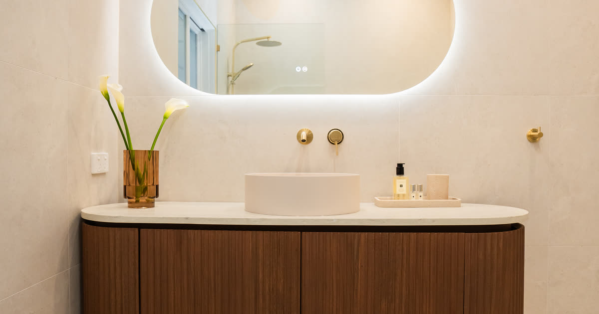 A variety of bathroom tile samples including ceramic, porcelain and natural stone arranged for comparison during a renovation consultation