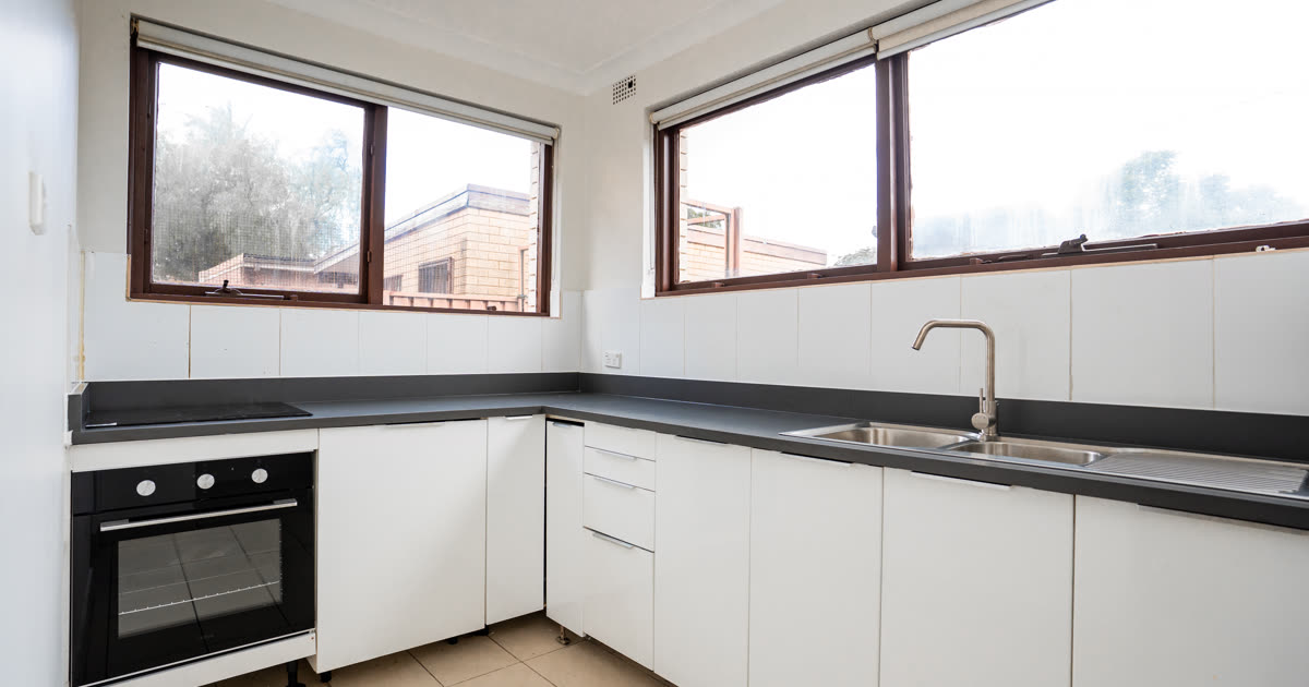 Modern kitchen with stylish splashback tiles in a contemporary North Shore renovation